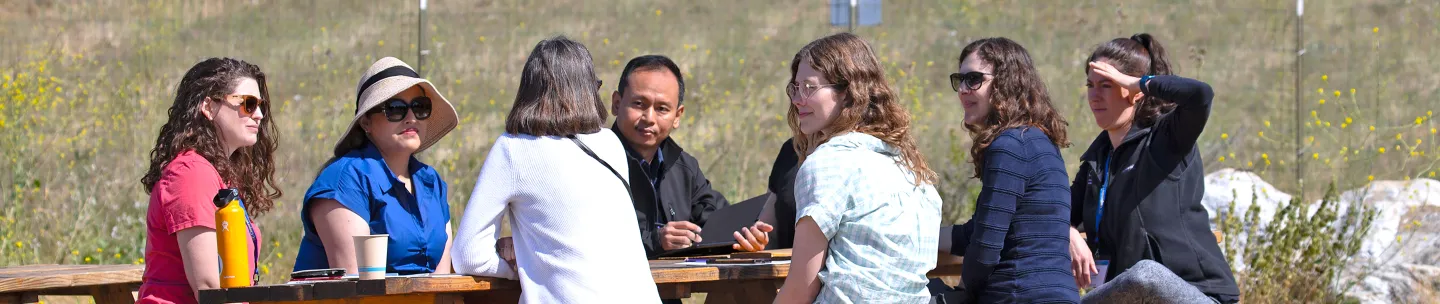 ANR staff talking at picnic table