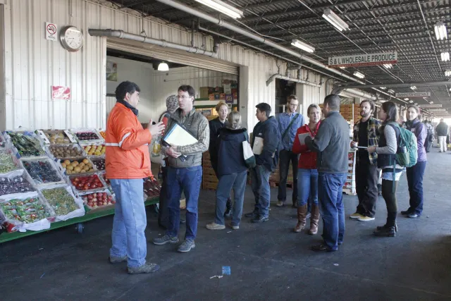 Thomas Nelson, 2nd from left, of the UC Sustainable Ag Research & Education Program that organized the tour, talks with Michael Janis, market director