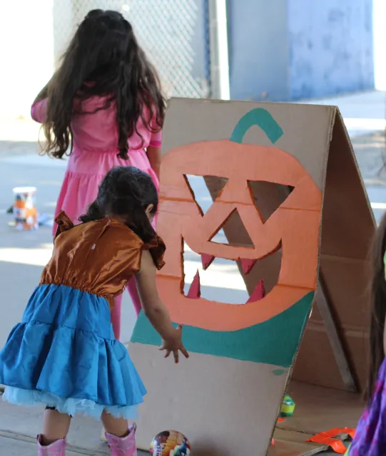 Playing toss at Halloween party (NSFS repository)