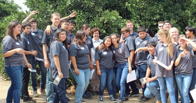 Woodlake High School student pose with Beth Grafton-Cardwell at the UC Lindcove Research and Extension Center near Exeter.