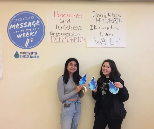 Project 4-H20 teens displaying the drinking water promotion message of the week