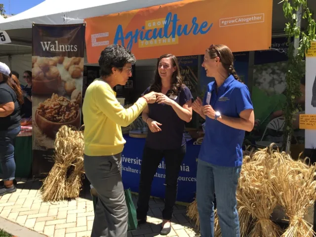 Michelle Leinfelder-Miles and Anne Megaro greeted Assembly Agriculture Committee Chair Susan Eggman of Stockton.