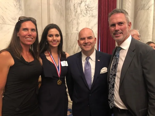 Elizabeth Sugarman, Sissy Sugarman, Ray Kerins of Bayer Corporation, and Shawn Sugarman at the Congressional Gold Medal award ceremony