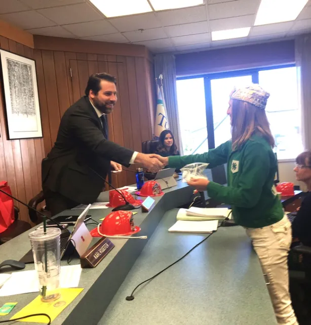 Supervisor Ryan Campbell shaking the hand of Belle, Tuolumne County Ambassador