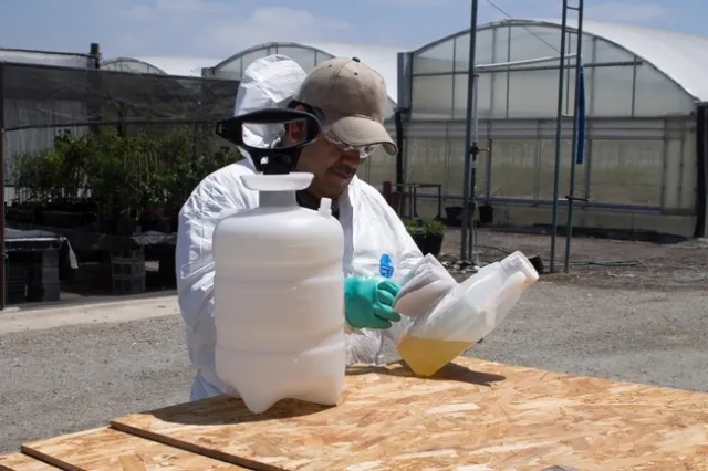 Coveralls should be worn for applications where contact with spray residue is likely. Photo by Katrina Hunter