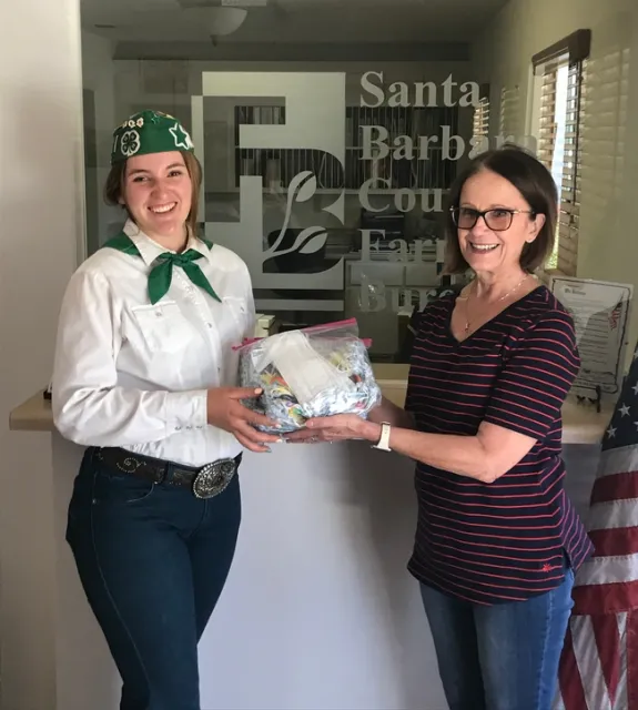 Olivia delivering 100 face masks to the Santa Barbara Farm Bureau.