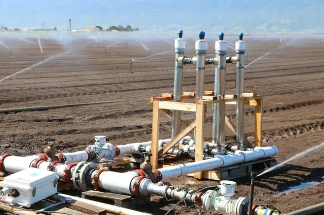 Figure 1. Prototype PAM applicator in a sprinkler irrigated lettuce field.