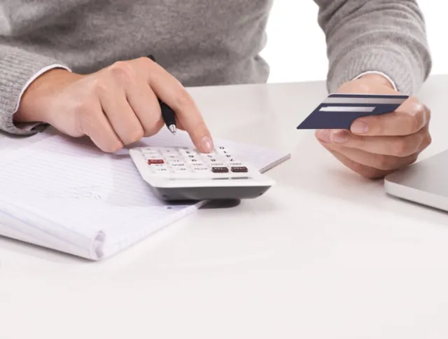 Hand punching numbers in calculator