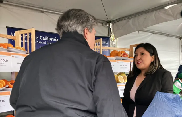 Glenda Humiston greets Senator Melissa Hurtado.