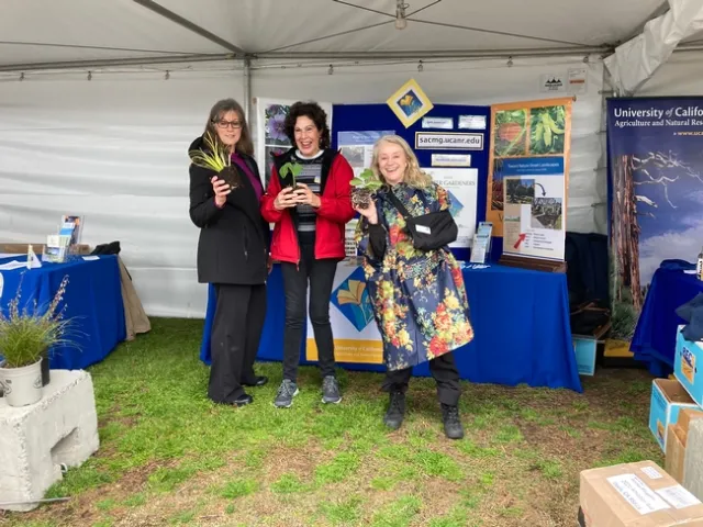 UC Master Gardeners give gardening advice to visitors.