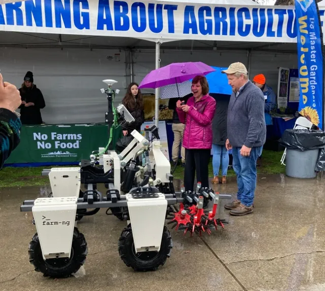 Karen Ross test drives a farm robot.