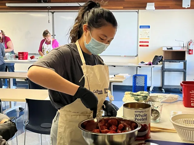 UC Master Food Preserver volunteers demonstrating a preservation technique