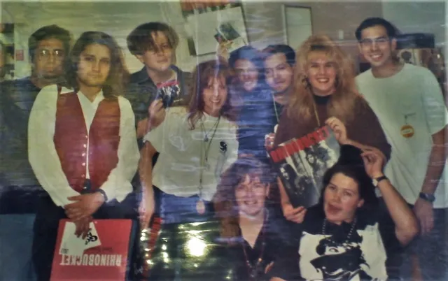 Ten teenagers/young adults pose for a group photo.