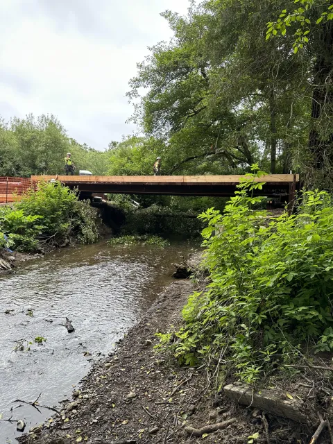 Bridge from creek nearing completion