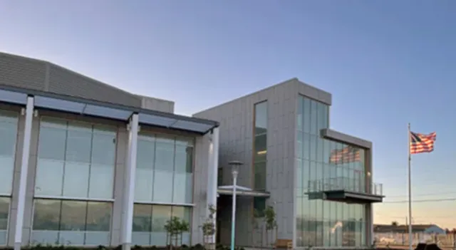 A glass and concrete building.