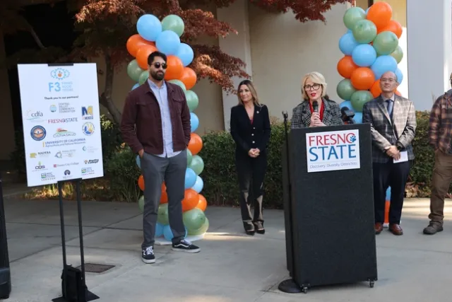 Ashley Swearengin speaks behind a lecturn that reads