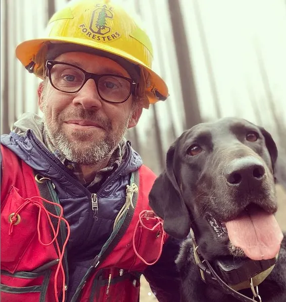 Tompkins pictured with his dog Boone.