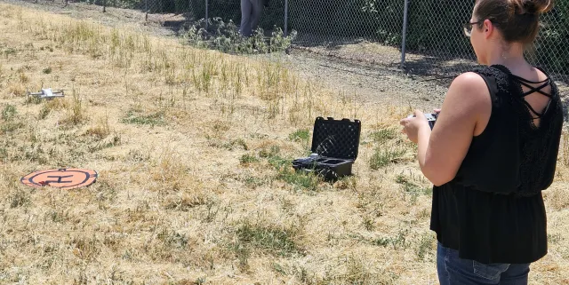 Educator flying a drone