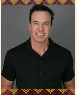 Headshot of Regent Sarris wearing a black shirt.