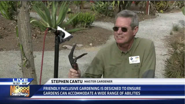 Screenshot of a Good Morning San Diego news video featuring a man speaking into a microphone in a garden from a wheelchair. Caption on scrennshot says "Stephen Cantu, Master Gardener. Friendly inclusive gardening is designed to ensure gardens can accommodate a wide range of abilities."