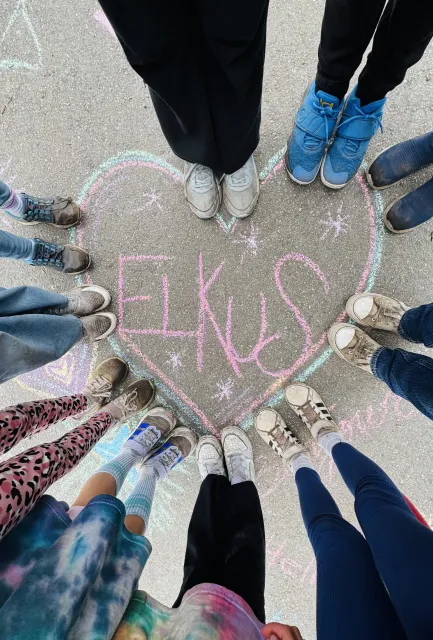 Image of students around an Elkus heart chalk-drawing showing their love of Elkus Ranch.
