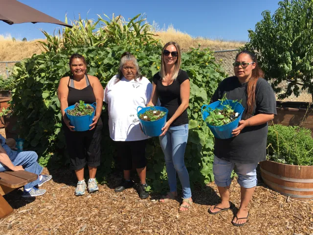 Lake County Tribal Health members at Legacy Garden learning how to do container gardening