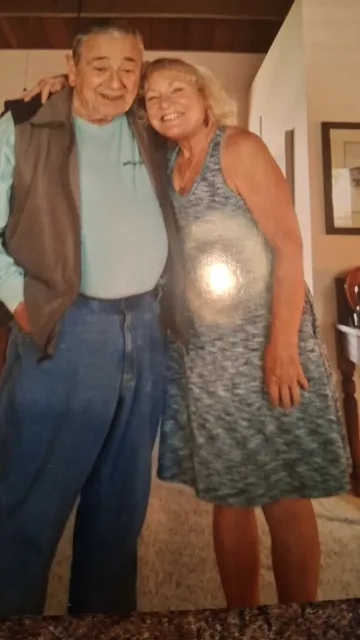 Pete Passof and Kim Rodriques stand together with Kim leaning her head against his shoulder