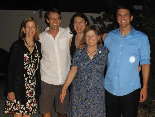 Jodie and Edie pose with 3 grad students