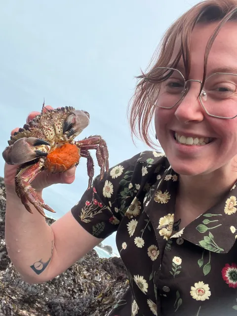 UC Davis doctoral candidate Madison Henrick with crab.
