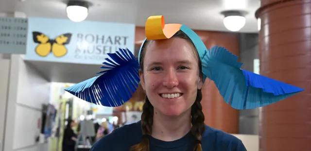 Bohart Museum intern Emeiine Hufftaker with the moth antennae headband she crafted.