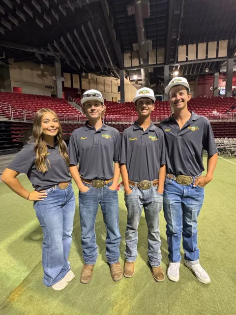 a picture of Kaylee G., Bryce B., Bradley H., and Reid., H. at the national shooting sports competition
