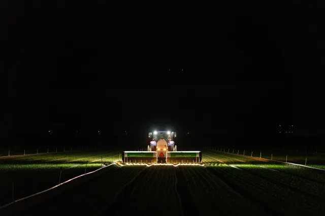 AI-powered precision application aims individual micro-shots at weeds or crops during nighttime