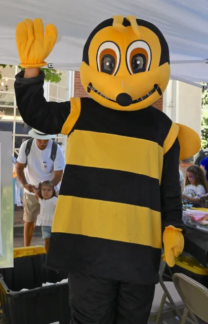 Kian Nikzad, as a bee, waves to the crowd at the Vacaville Museum Guild's 2025 Children's Party.