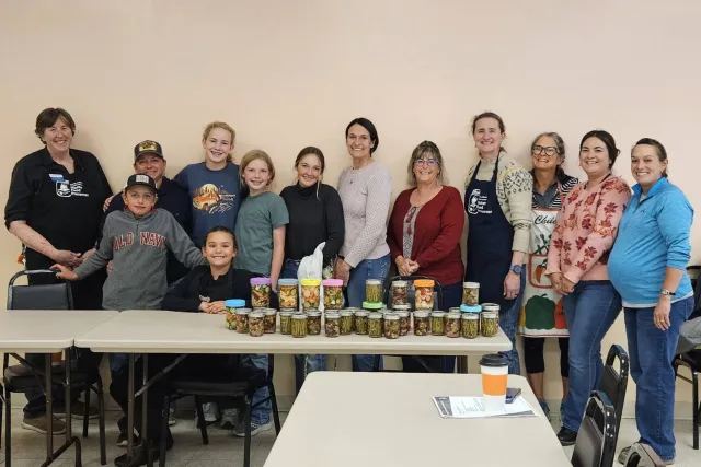 Modoc County's first Junior Master Food Preserver class pose for a group photo in a classroom