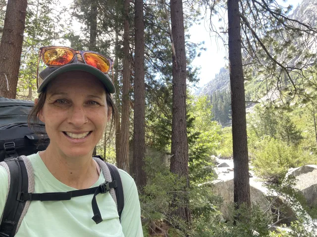 Kristin Polidoro smiles as she nears the end of her backpacking trip in Kings Canyon on the Rae Lakes loop