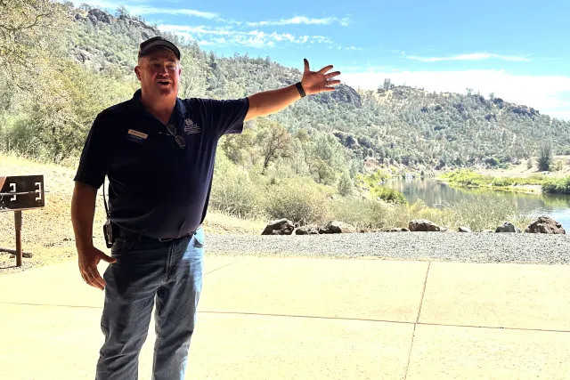 Dustin Flavell gestures toward the Yuba River at Sierra Foothill REC