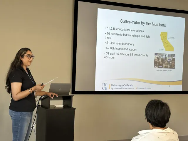 UCCE area director Preet Ahluwalia addresses the group at Sierra Foothill REC's meeting room