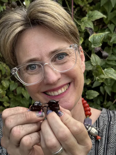 Stephanie Dole holding rain beetles.