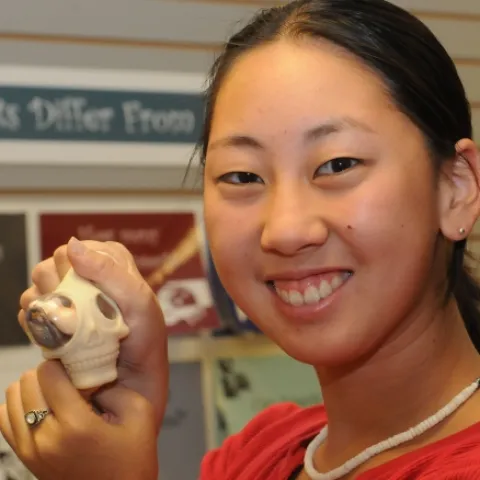 Squeeze this stress ball and out will pop either assorted bugs, worms, frogs or rats. Nanase Nakanishi, a UC Davis student majoring in animal science, and an employee at the Bohart Museum of Entomology, displays what it does. (Photo by Kathy Keatley Garvey)