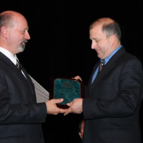 FELLOW AWARD--ESA President Michael Gray (left) presents the highly acclaimed Fellow award to UC Davis entomologist Michael Parrella. (Photo by Kathy Keatley Garvey)