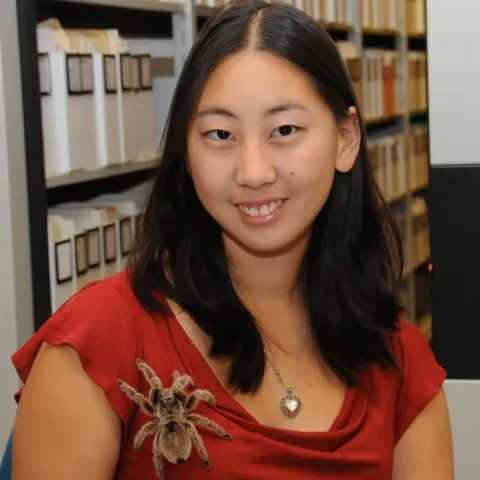 NEW BROOCH--Nanase Nakanishi, a UC Davis student who plans to become a veterinarian, cares for this rose-haired tarantula at the Bohart Museum. It's one of the live insects in the museum, which houses more than seven million specimens. (Photo by Kathy Keatley Garvey)