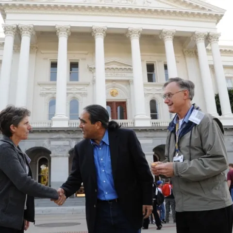 CALIFORNIA SECRETARY OF AGRICULTURE A. G. Kawamura (center) greets Lynn Kimsey, director of the Bohart Museum of Entomology and professor and vice chair of the UC Davis Department of Entomology. At right is Extension apiculturist Eric Mussen, also a member of the UC Davis entomology faculty and parliamentarian of the California State Beekeepers' Association. (Photo by Kathy Keatley Garvey)