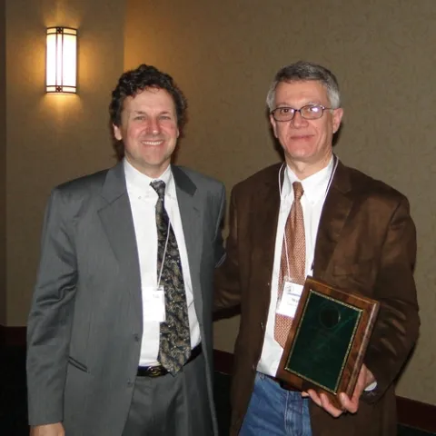 CHEMICAL ECOLOGIST Walter Leal (right) is the 2010 recipient of the prestigious C. W. Woodworth Award, presented by Woodworth's great-grandson Brian Holden (left) at the 94th annual meeting of the Pacific Branch of the Entomological Society of America. (Courtesy Photo)