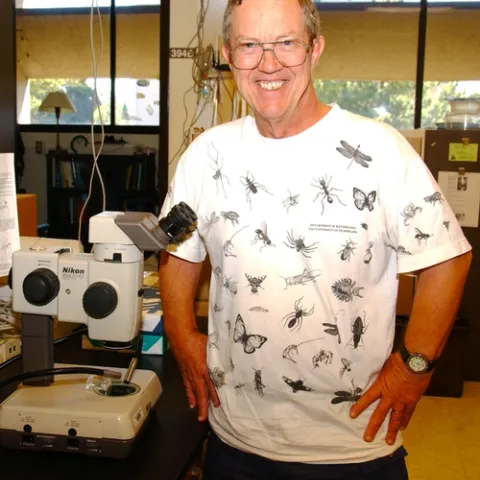 EMERITUS PROFESSOR Hugh Dingle, shown here wearing one of his favorite "bug" shirts, will discuss the rapidly evolving soapberry bug at a noon seminar on Wednesday, Nov. 10 in 122 Briggs Hall, UC Davis. (Photo by Kathy Keatley Garvey)
