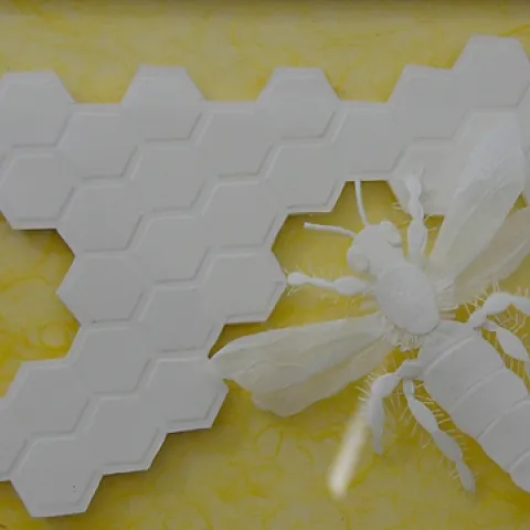 'QUEEN BEE' is a paper sculpture by talented artist Marilyn Judson of Davis. This is a three-dimensional art piece now on display in the Pence Gallery, Davis. The background of this photo was darkened in Photoshop for contrast purposes.(Photo by Kathy Keatley Garvey)