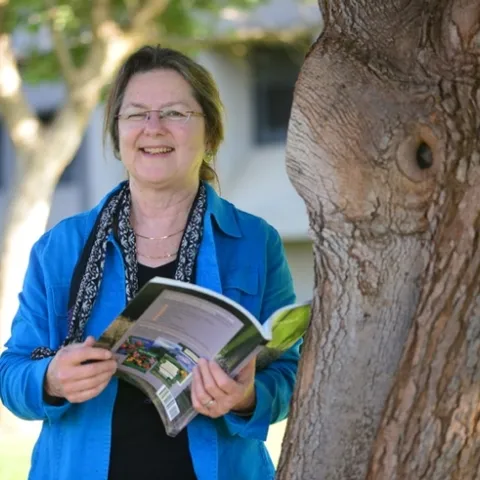 Mary Lou Flint outside her new office at Briggs Hall. (Photo by Kathy Keatley Garvey)