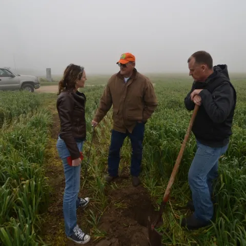 Amelie Gaudin discussing ecological practices with farmers.