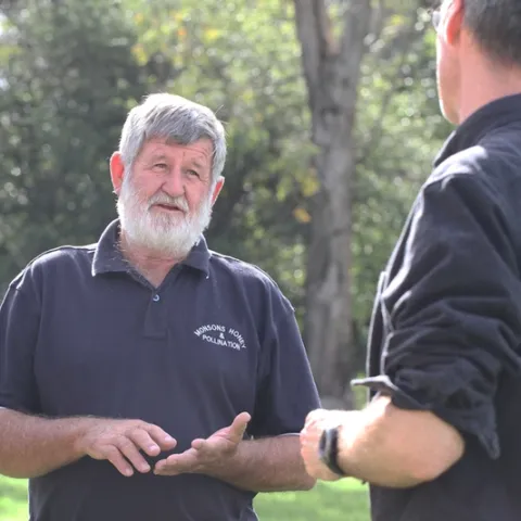Apiarist/pollination specialist Trevor Monson (left) talks bees with pollination ecologist Neal Williams, associate professor, UC Davis Department of Entomology and Nematology. (Photo by Kathy Keatley Garvey)