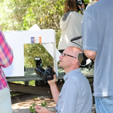 Alex Wild shows photographers some white box techniques at BugShot Hastings. (Photo by Kathy Keatley Garvey)