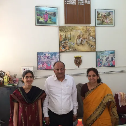 (left to right) Devii Rao, Dr. K. Satyanarayan and Dr. Jagadeeswary at the Veterinary University in Bengaluru with beautiful scenes of agricultural life depicted above us on the wall.